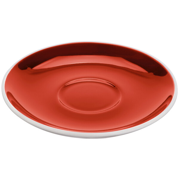 A CAC red coffee cup with a white saucer.