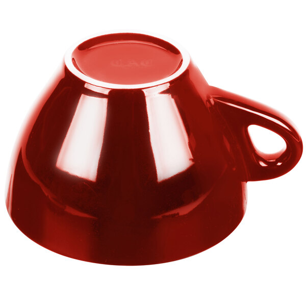 A CAC Venice red coffee cup with a handle on a saucer.