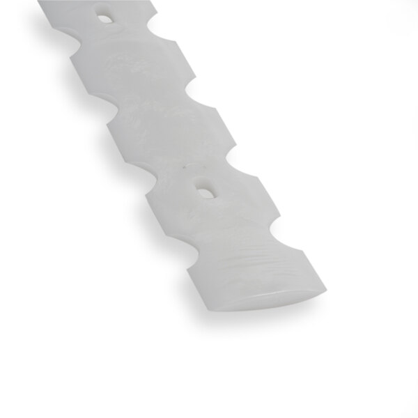 A white plastic blade with holes on it.