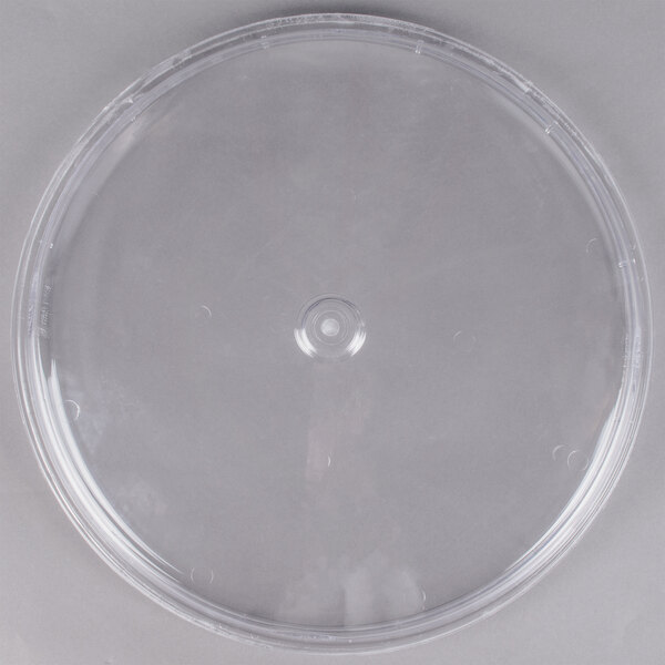 A clear plastic bowl cover with a hole.