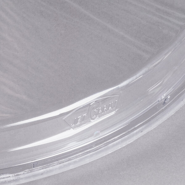A clear plastic bowl cover with a logo on it.