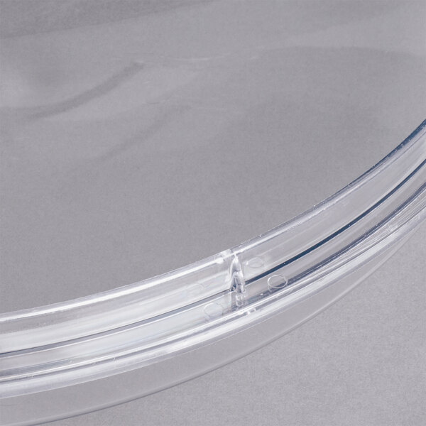 A clear plastic bowl cover for a Cornelius refrigerated beverage dispenser.