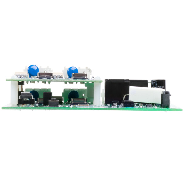 A close up of a white electronic board with blue and green components.