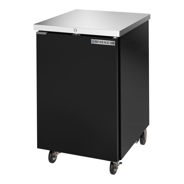A black counter height solid door back bar refrigerator with a stainless steel top and casters.
