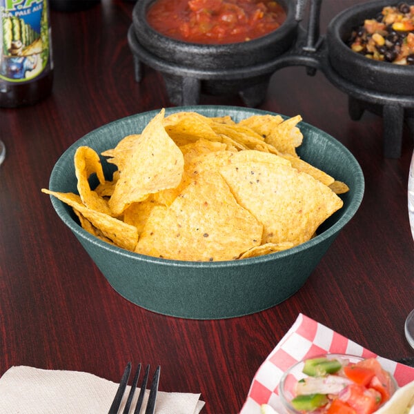 A round polyethylene basket filled with jalapenos.