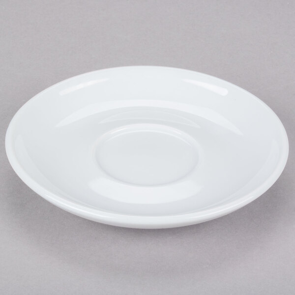 A CAC Venice white saucer with a small rim.