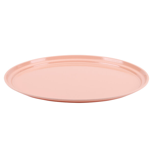 A dark peach oval Cambro tray with a round rim on a white background.