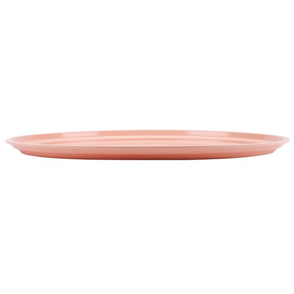 A dark peach Cambro oval tray on a white table.