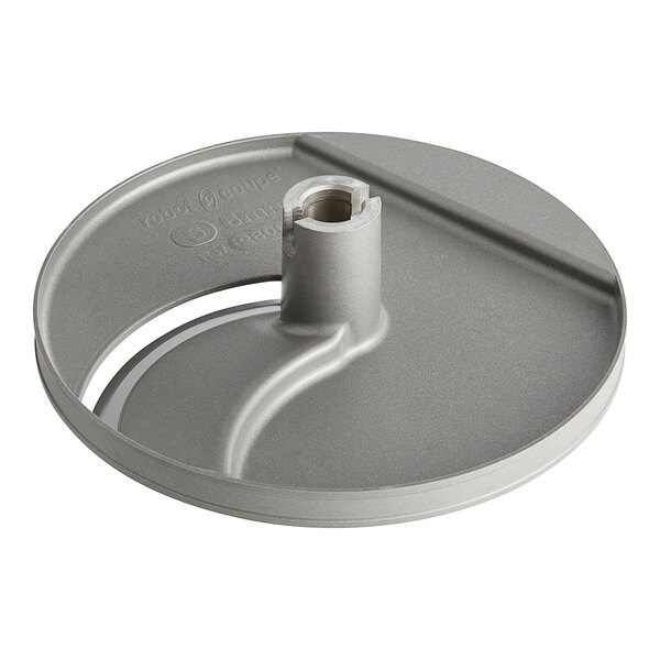 A grey circular Robot Coupe slicing disc with a hole in it.