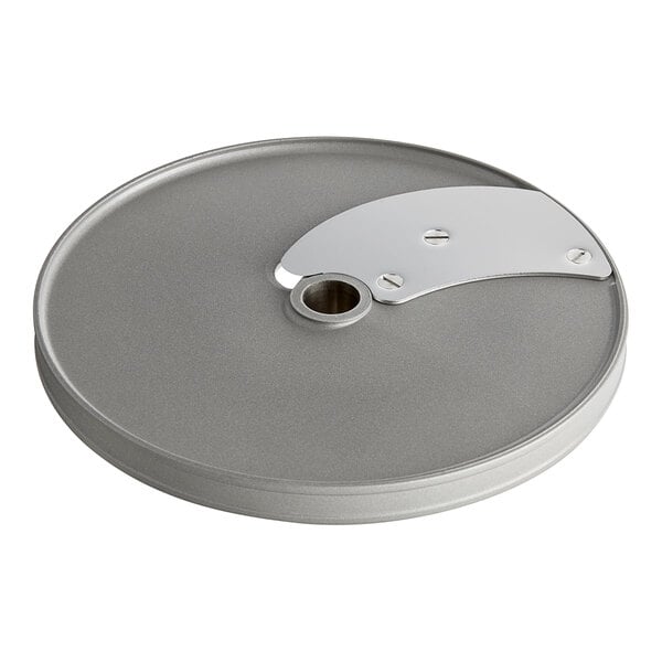 A silver circular metal Robot Coupe slicing disc with a hole in the center.