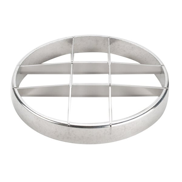 A circular metal object with four holes.