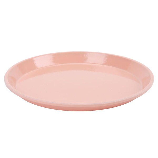 A dark peach Cambro low profile round fiberglass tray with a small rim on a white background.