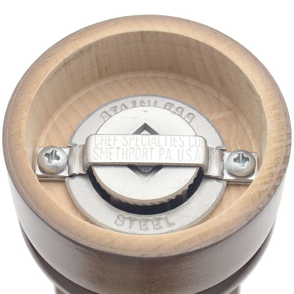 A close up of a Chef Specialties Capstan Walnut Pepper Mill with a metal screw lid.