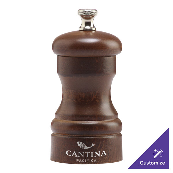 A Chef Specialties walnut pepper mill with a silver top.