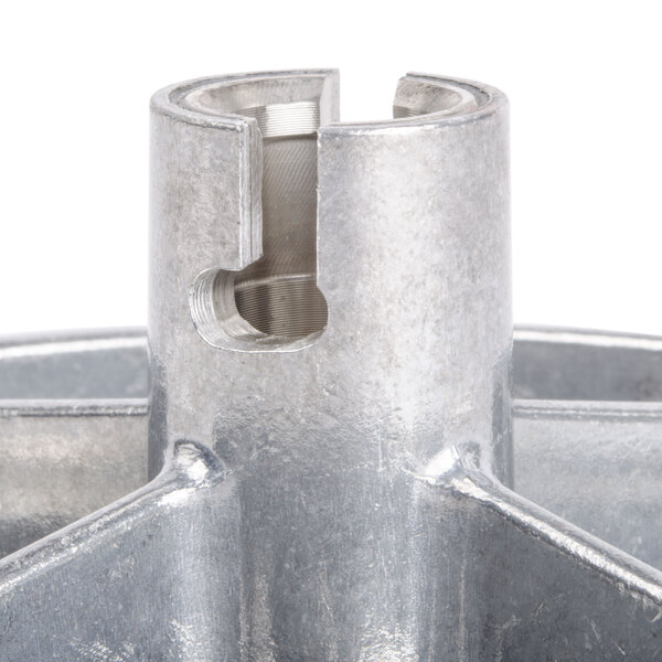 A Robot Coupe 5/32" grating / shredding disc with a hole in it.