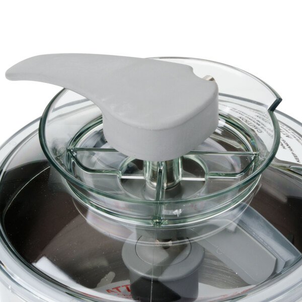 A stainless steel bowl with a white lid.