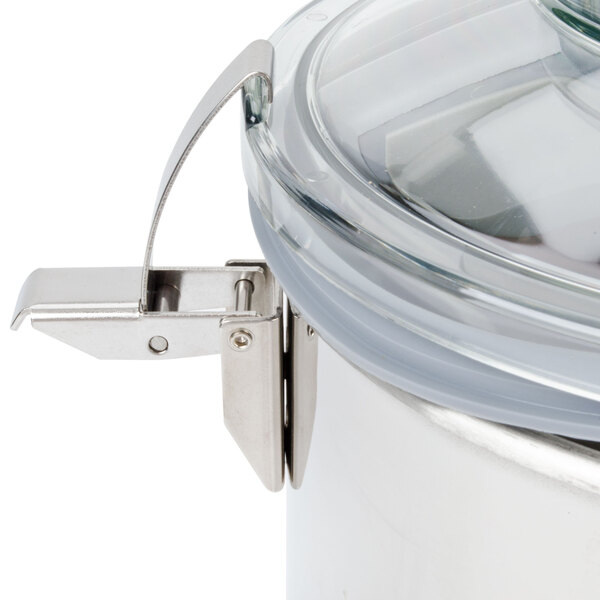 A Robot Coupe stainless steel bowl with a lid and handle.