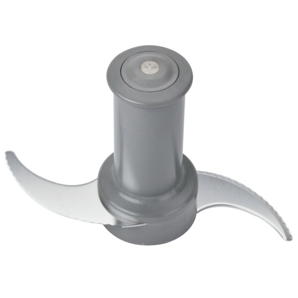 A stainless steel bowl with a grey food processor blade attached.