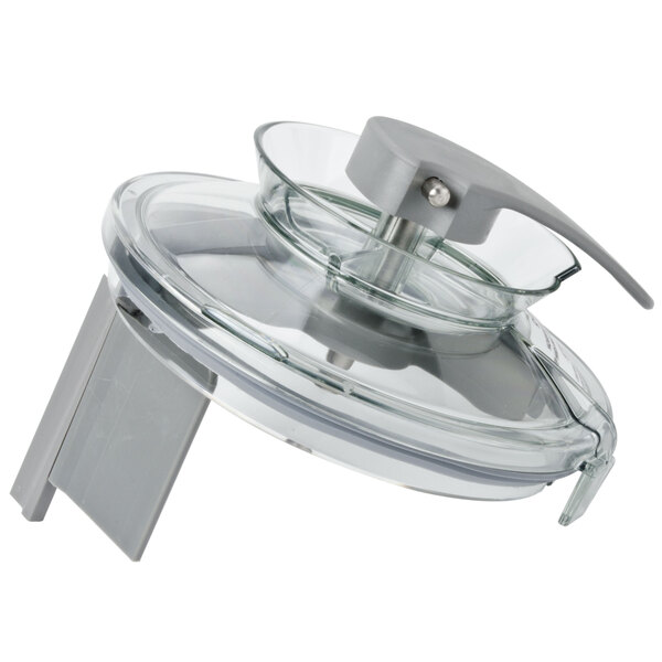 A clear plastic bowl with a grey handle.