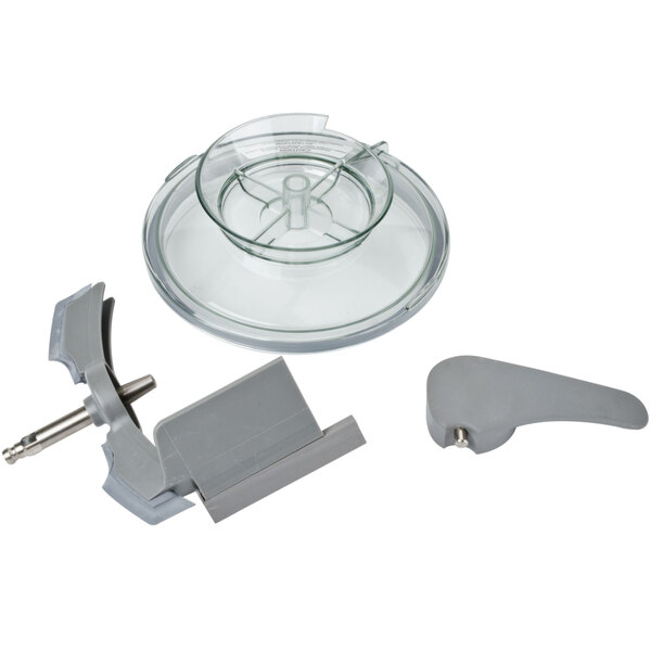 A stainless steel bowl with a metal handle and clear lid.