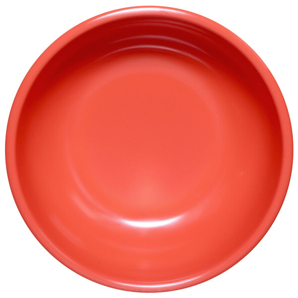 A close-up of a red Elite Global Solutions melamine bowl.