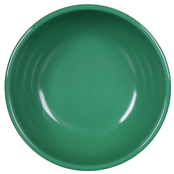 A close-up of a green bowl with a white background.