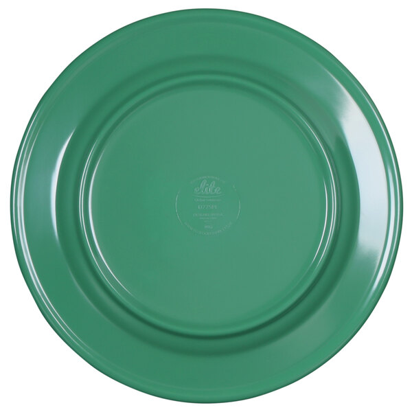 A close-up of a green Elite Global Solutions plate with a logo on it.