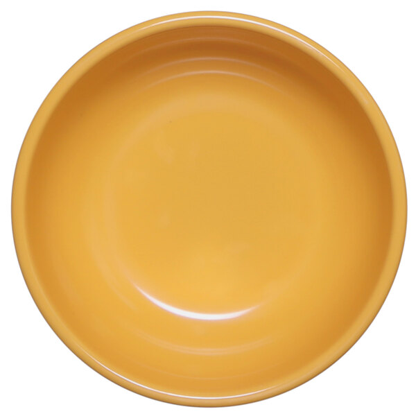 A yellow Elite Global Solutions melamine bowl.
