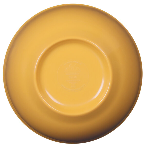 A yellow melamine bowl with a circular rim on a yellow plate.
