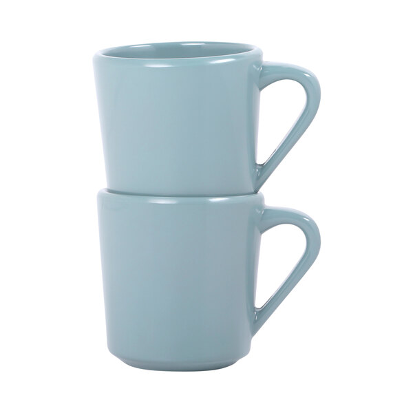 A stack of two blue Elite Global Solutions Urban Naturals Abyss melamine mugs with a close-up of the handle.