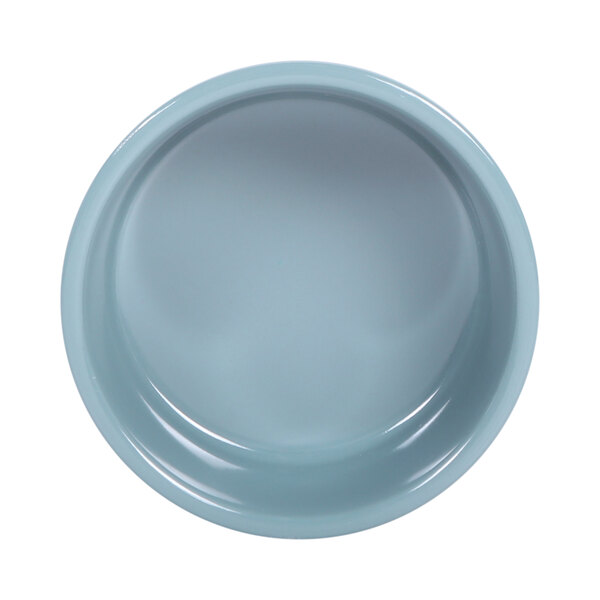 A close-up of an Elite Global Solutions white melamine ramekin.