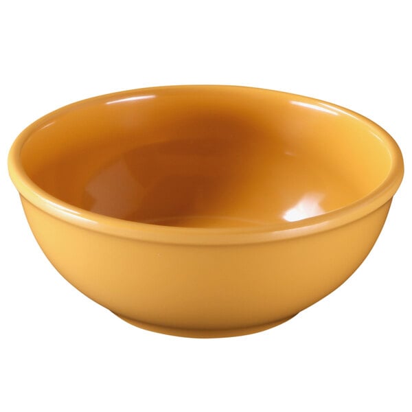 A yellow Elite Global Solutions melamine bowl.