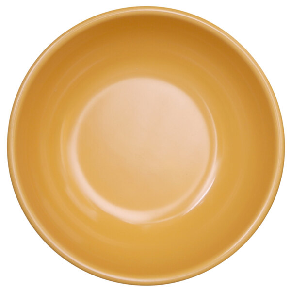 A close up of a yellow Elite Global Solutions Rio melamine bowl.