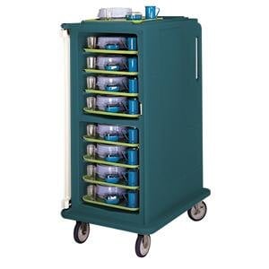 A green Cambro meal delivery cart with trays on it.