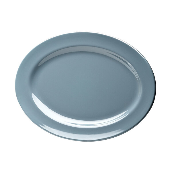 An Elite Global Solutions oval melamine platter with a white background and a blue rim.