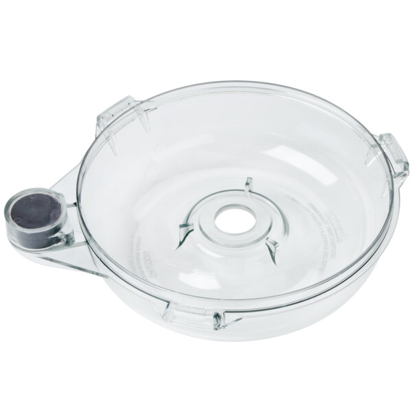 A stainless steel bowl with a hole in the bottom.