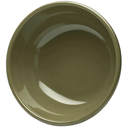 A green bowl with a white background and a brown rim.