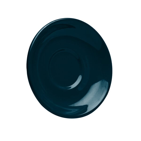 A dark blue Elite Global Solutions saucer with a white circle.