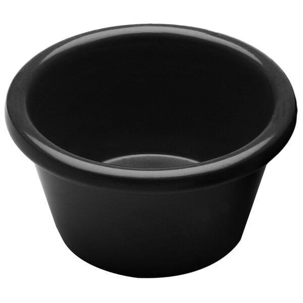 A black round melamine ramekin with a white background.