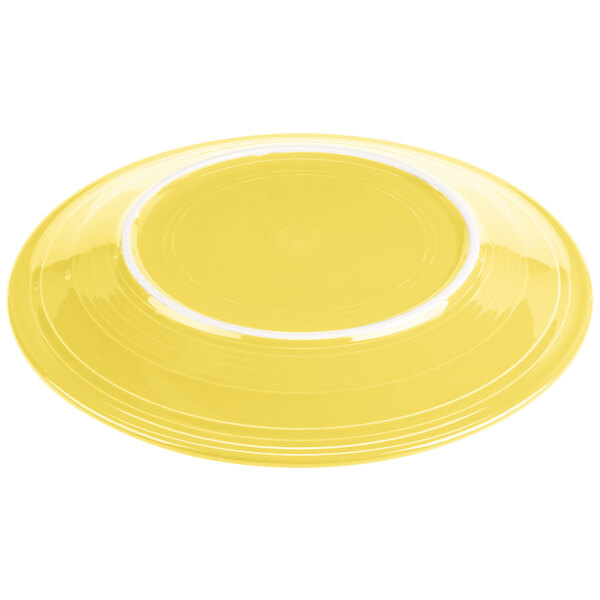 A yellow Fiesta® chop plate with a white rim.