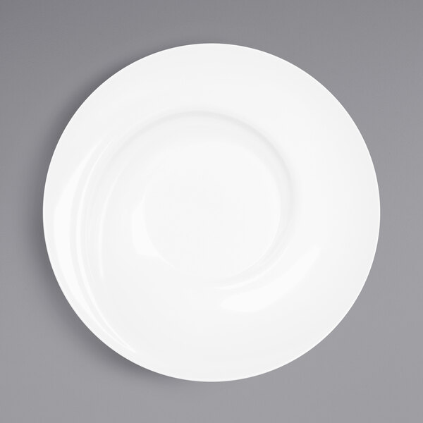 An Elite Global Solutions white melamine bowl with a spiral design on a white surface.
