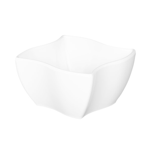 A white Elite Global Solutions square melamine bowl with a curved edge.