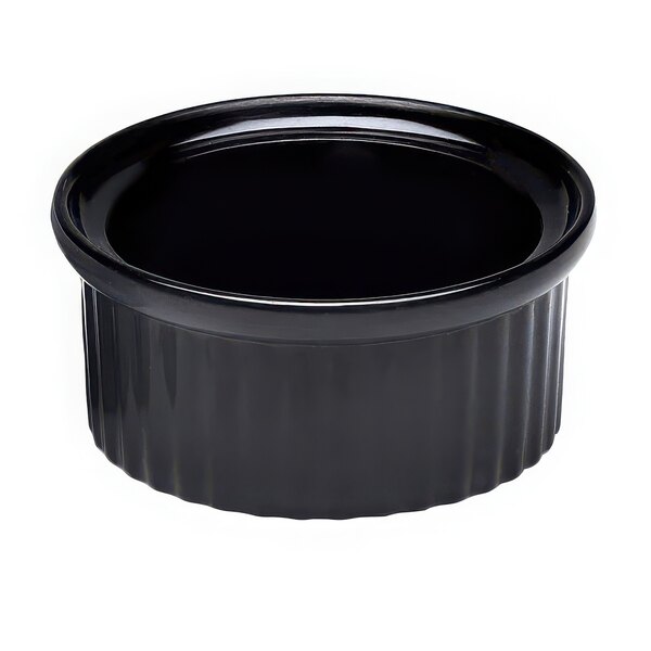 A black fluted melamine ramekin with a black bowl and black rim.