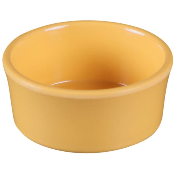 A yellow Elite Global Solutions melamine ramekin on a white background.