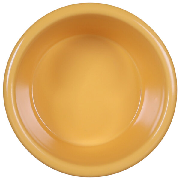 A yellow Elite Global Solutions melamine ramekin.