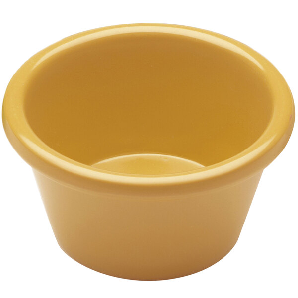 A yellow Elite Global Solutions melamine ramekin.