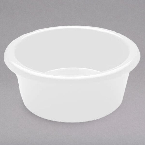 A white round melamine ramekin on a gray surface.