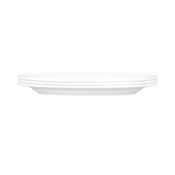A white oval melamine platter with three white oval platters on it.