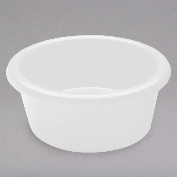 A white melamine ramekin on a gray surface.