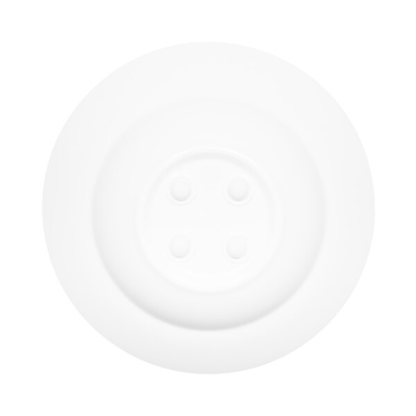 A white bowl with four circles on the rim.